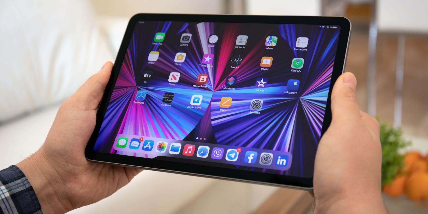 a man holding an 11 inch ipad pro